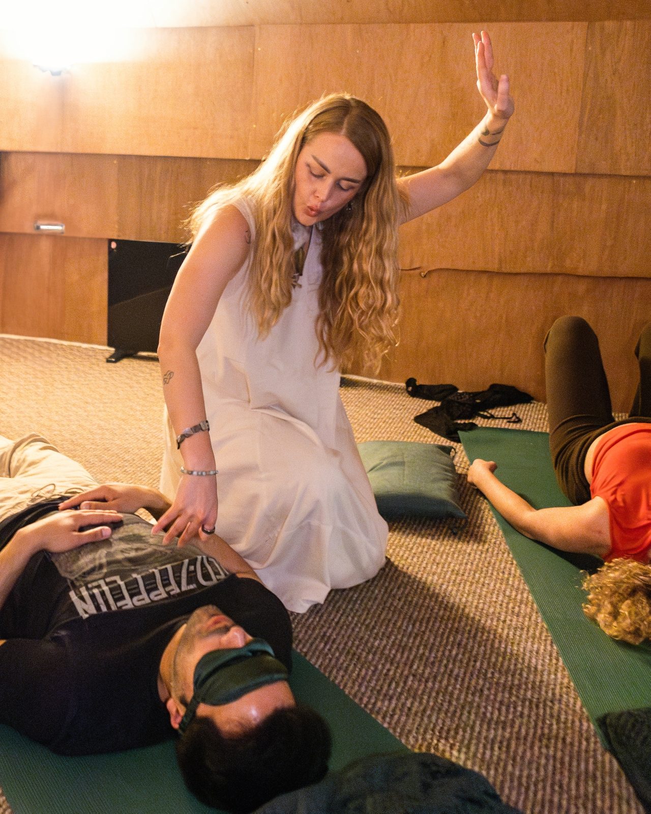Maia facilitating, hand raised over a participant