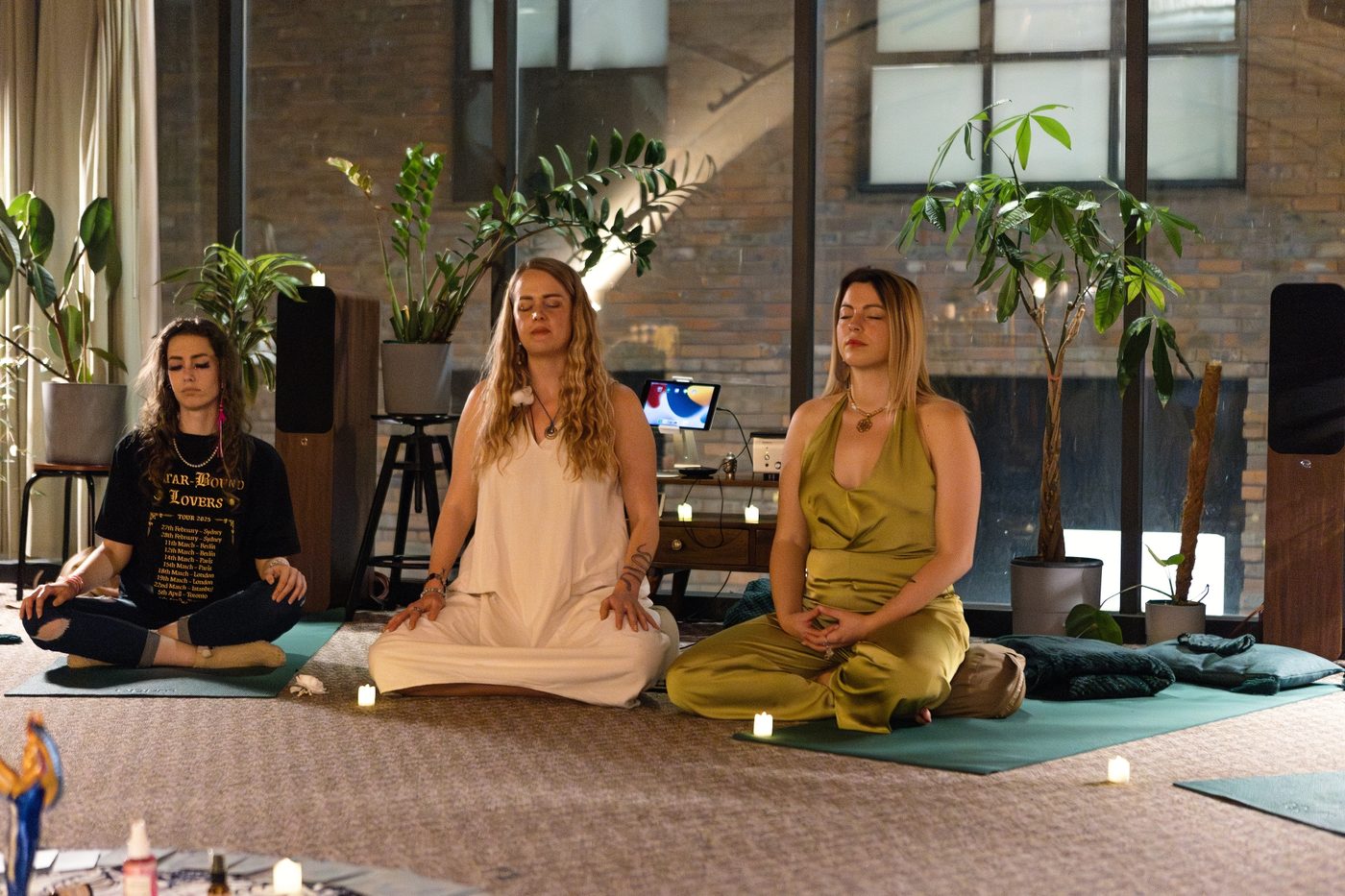 Maia and Monika seated together at the front of the room