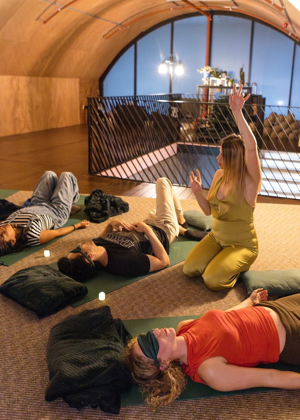 Several participants lying in the room as the ceremony is held